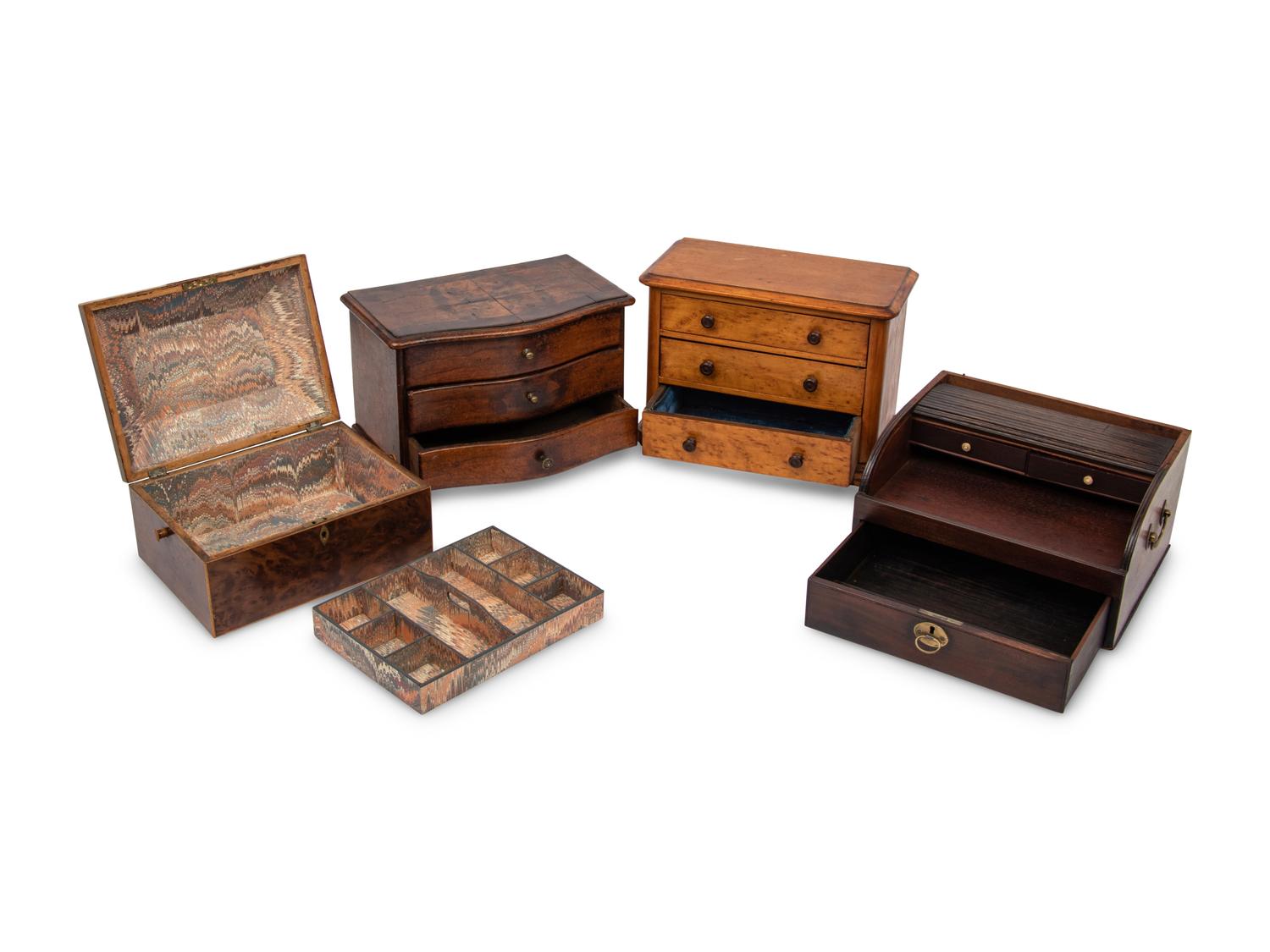 An English Yew Wood Tea Caddy, Two Diminutive Chests of Drawers and a Writing Box