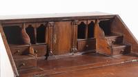 A George III Provincial Oak Slant-Front Secretary Desk