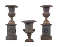 A Pair of Iron Garden Urns with Associated Plinths and Another Garden Urn
