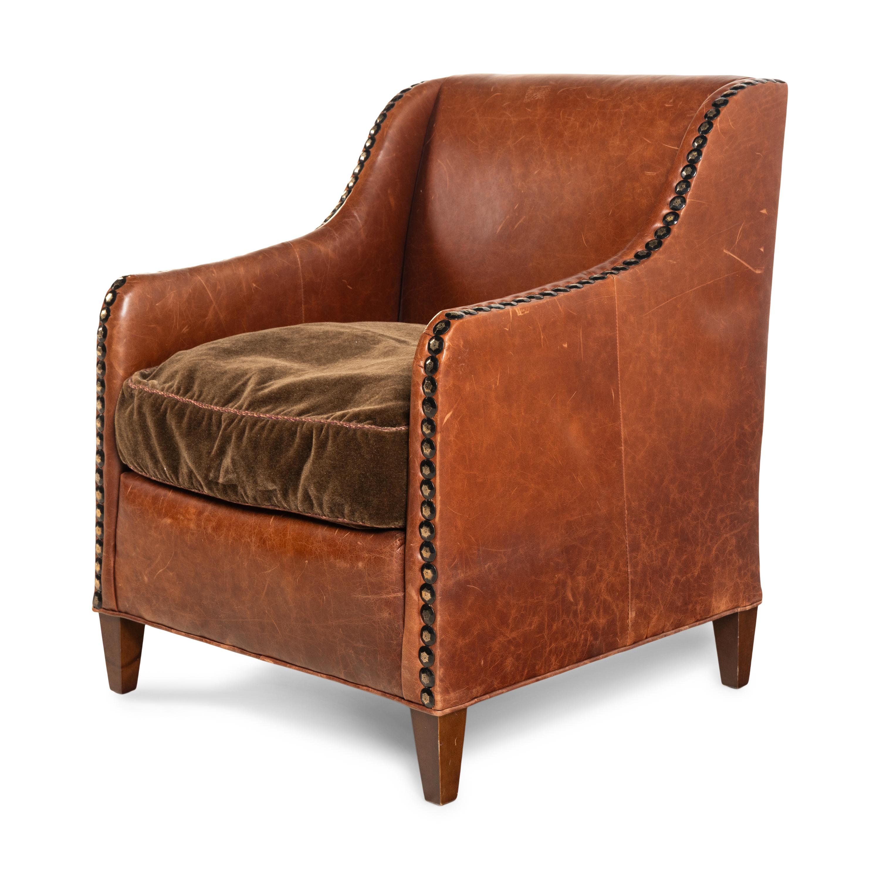 A Leather and Velvet Upholstered Armchair