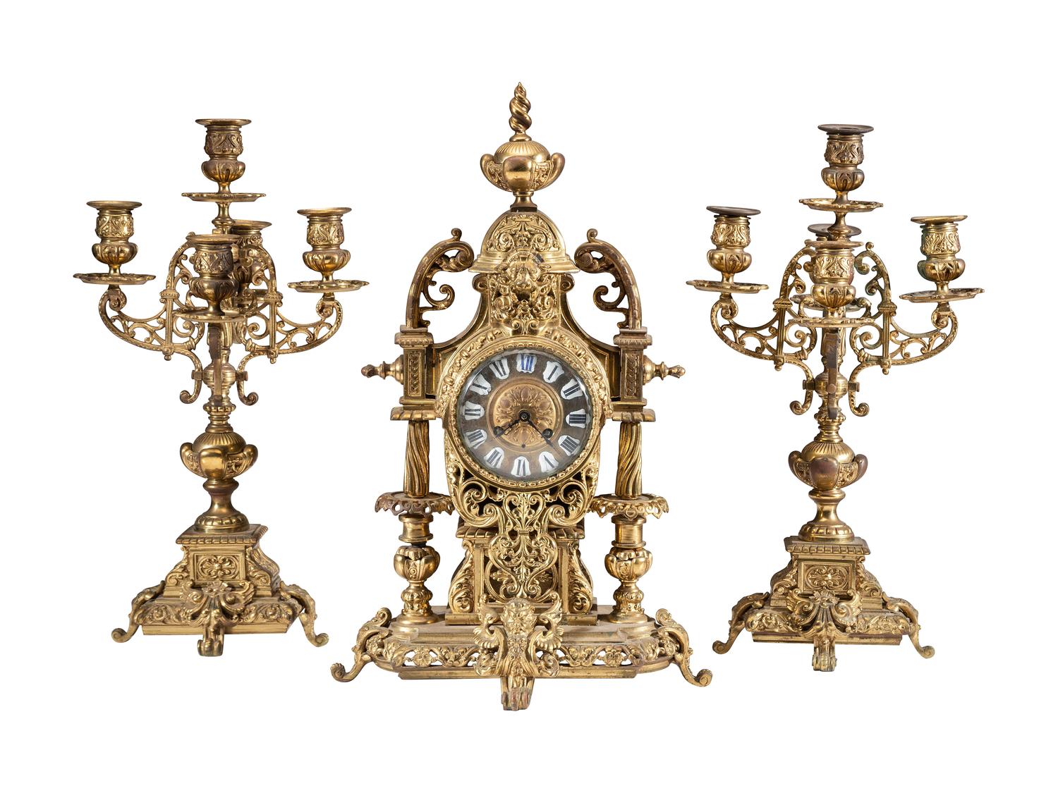 A Continental Gilt Bronze Three-Piece Clock Garniture