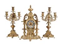 A Continental Gilt Bronze Three-Piece Clock Garniture