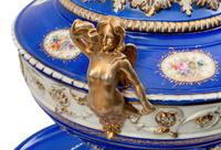 A Pair of German Porcelain Tureens, Covers and Stands