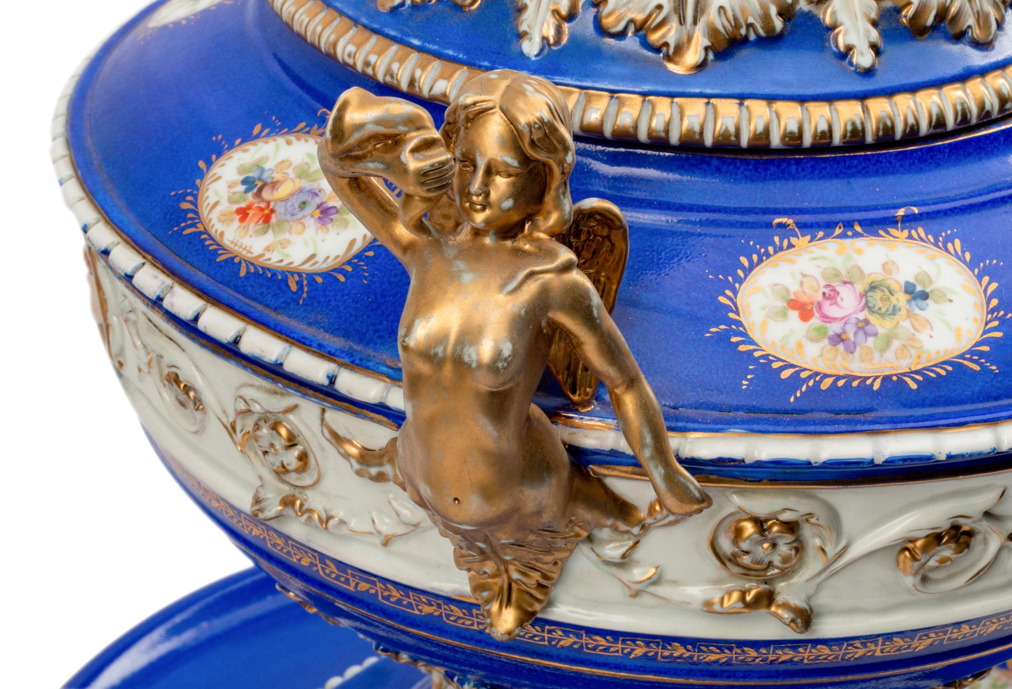A Pair of German Porcelain Tureens, Covers and Stands