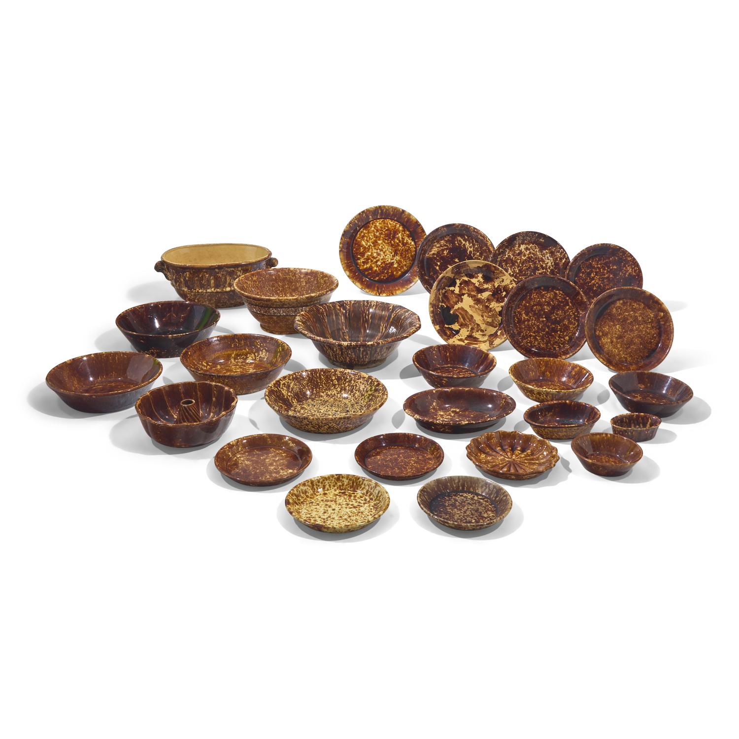 A Large Group of Twenty-Seven Bennington or Rockingham Glazed Earthenware Items