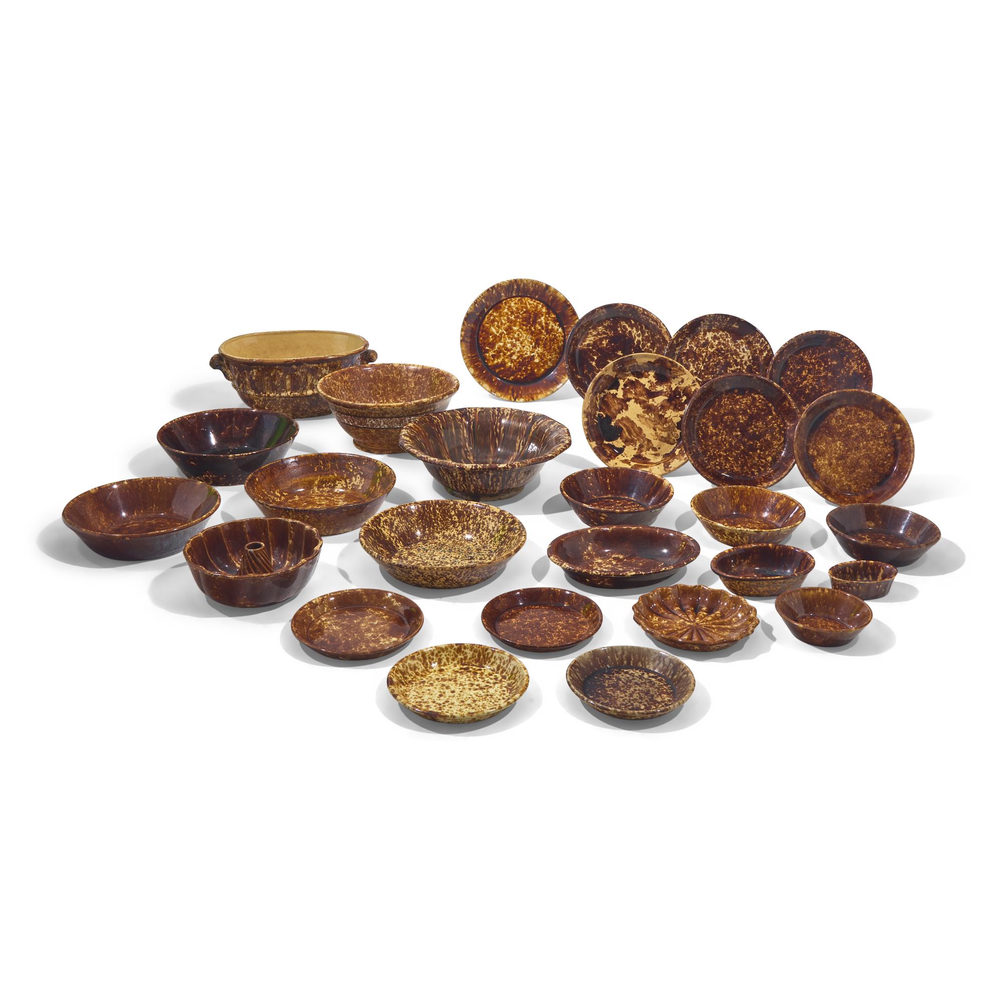 A Large Group of Twenty-Seven Bennington or Rockingham Glazed Earthenware Items