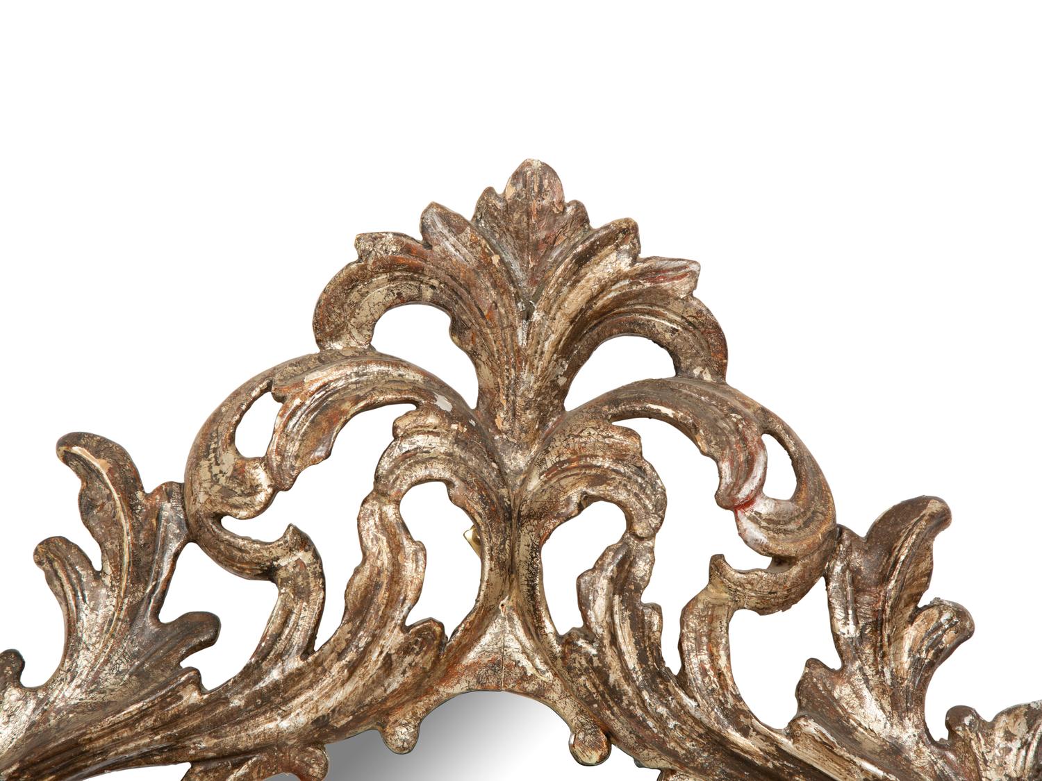 An Italian Baroque Style Silvered Wood Mirror