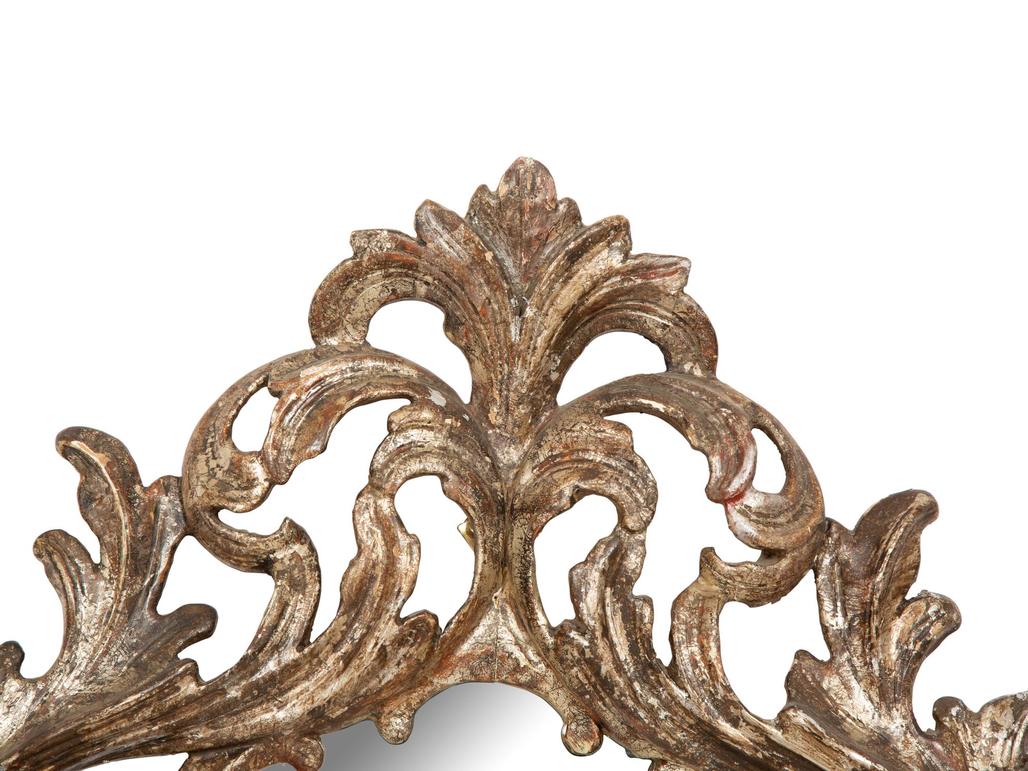 An Italian Baroque Style Silvered Wood Mirror
