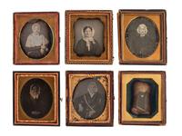 [EARLY PHOTOGRAPHY]. A group of 23 daguerreotype and tintype portraits of subjects with glasses, including: