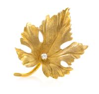 A Yellow Gold and Diamond Maple Leaf Brooch, Tiffany & Co., 1.80 dwts.