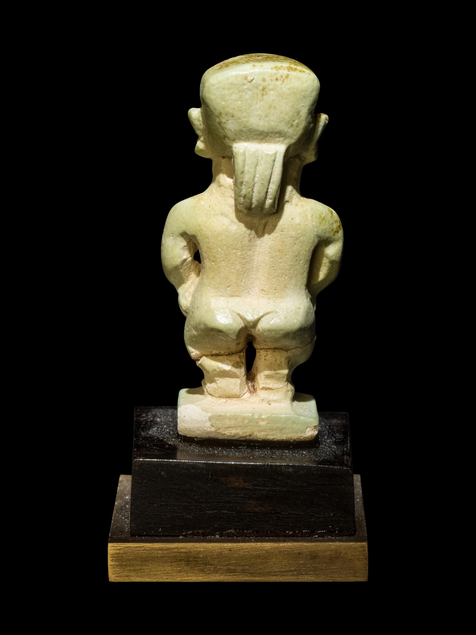 Three Egyptian Faience Amulets Including a Pataikos, a Harpocrates, and a Recumbent Lion