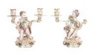 A Pair of Chelsea Porcelain Figural Two-Light Candlesticks Height 11 inches.
