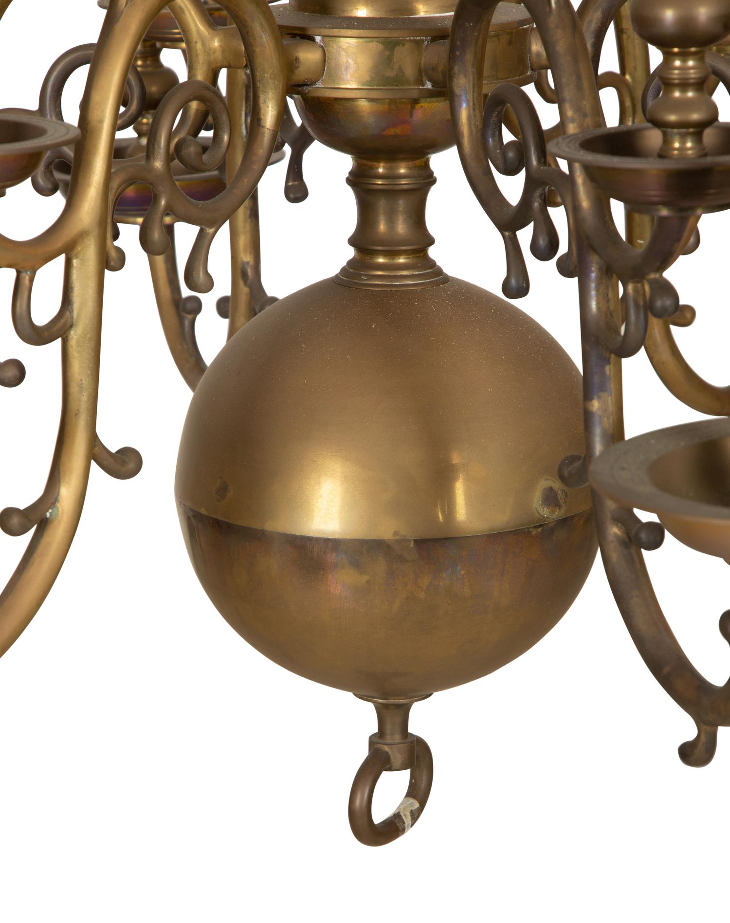 A Baroque Style Brass Twelve-Light Chandelier