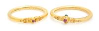 A Collection of High Karat Gold, Ruby and Emerald Bangle Bracelets, 33.60 dwts.