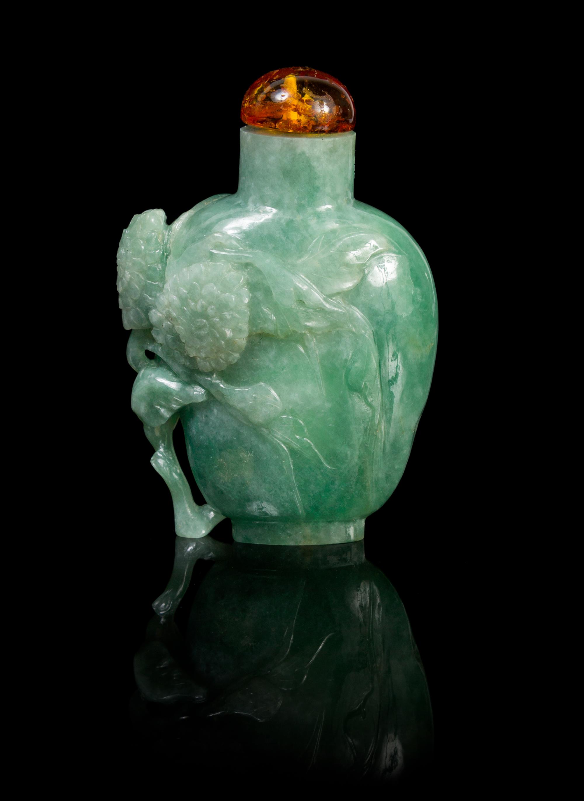 A Chinese Jadeite Snuff Bottle Height 2 x width 1 3/4 inches.