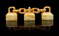A Group of Three Celadon and Russet Jade Seals Length overall 4 inches.