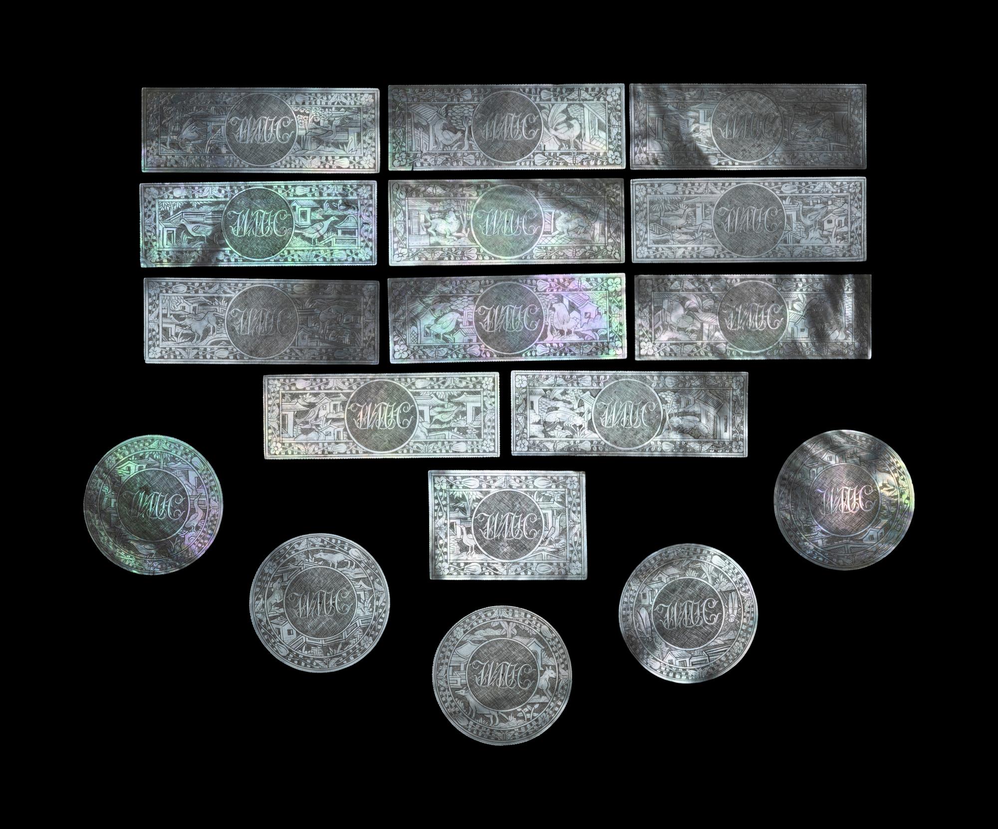 Seventeen Carved Mother-of-Pearl Game Pieces