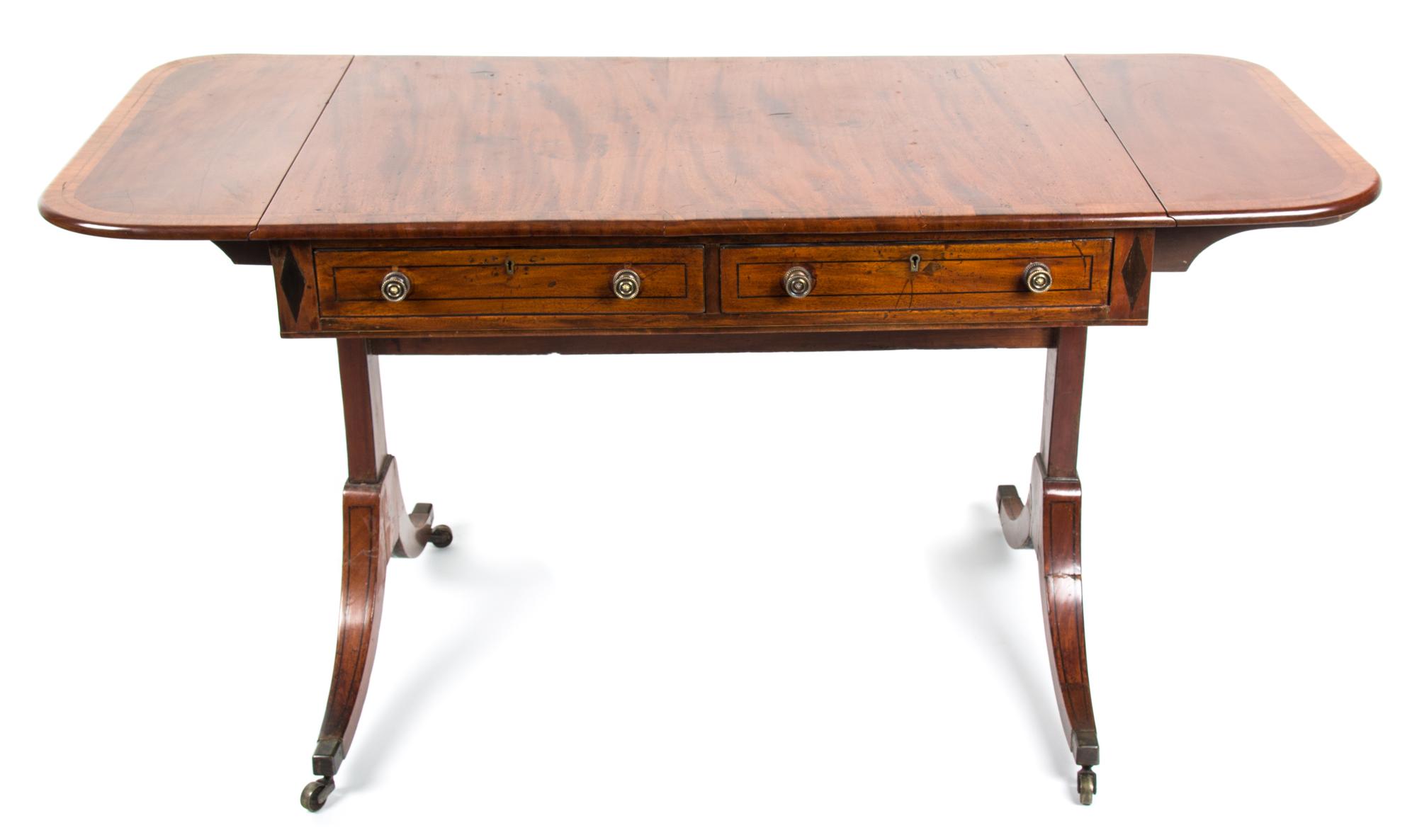 A Regency Mahogany Sofa Table Height 27 1/2 x width 53 1/2 x depth 24 1/2 inches. — SECOND QUARTER 19TH CENTURY