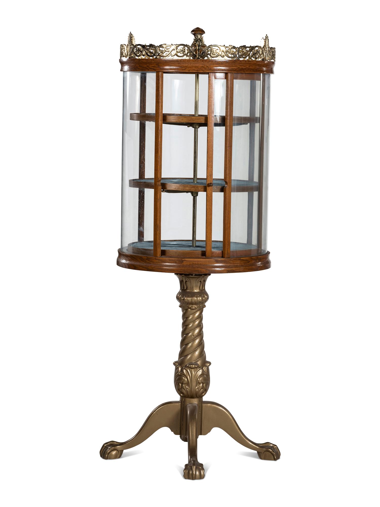 A Gilt Metal Mounted Oak Crystal Case Co. Revolving Display Case