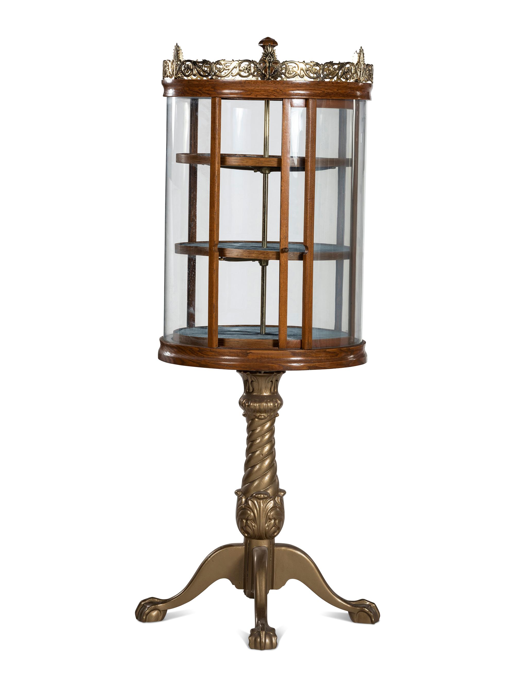 A Gilt Metal Mounted Oak Crystal Case Co. Revolving Display Case