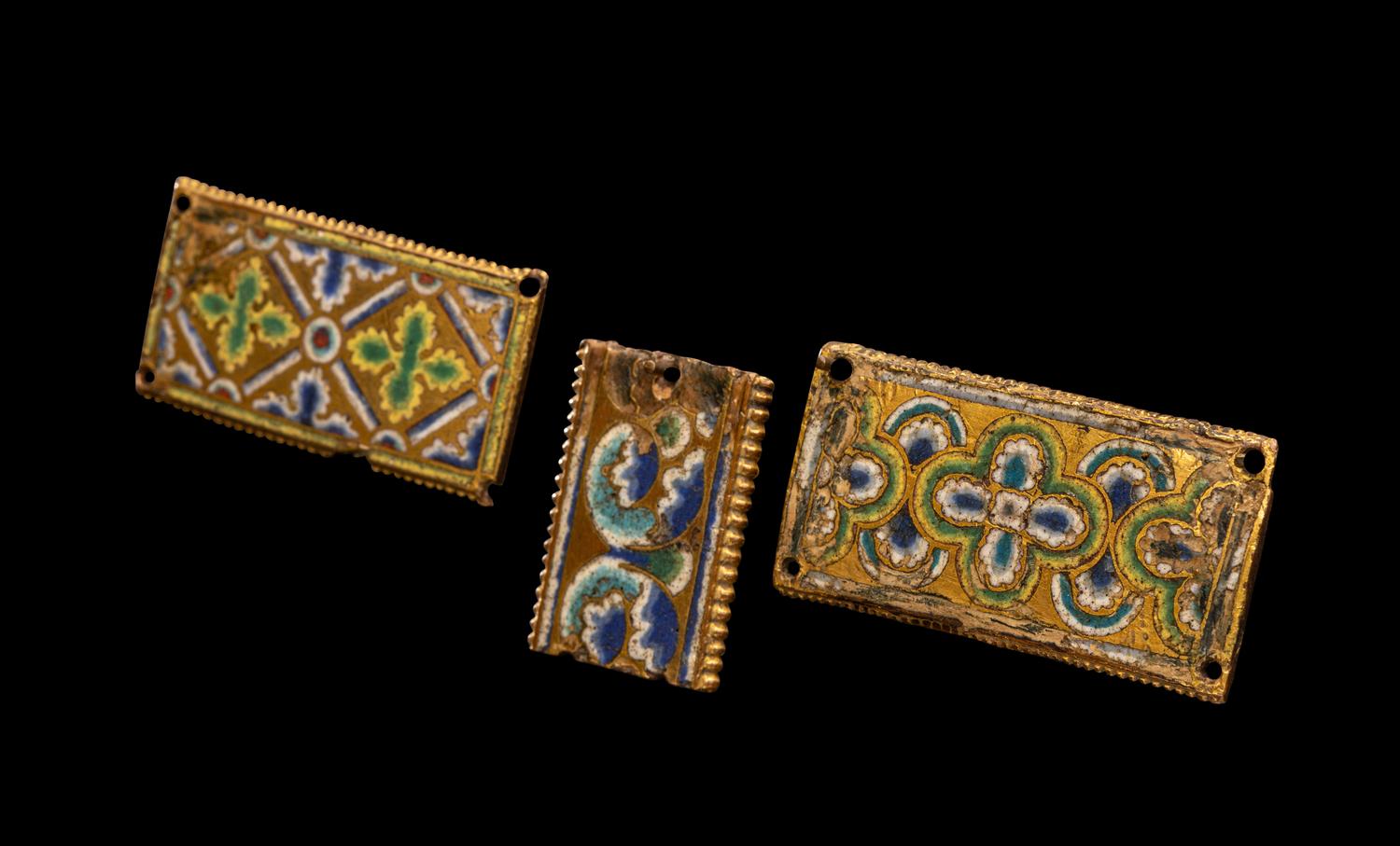Three Rhenish Champlevé and Gilt Copper Framing Plaques