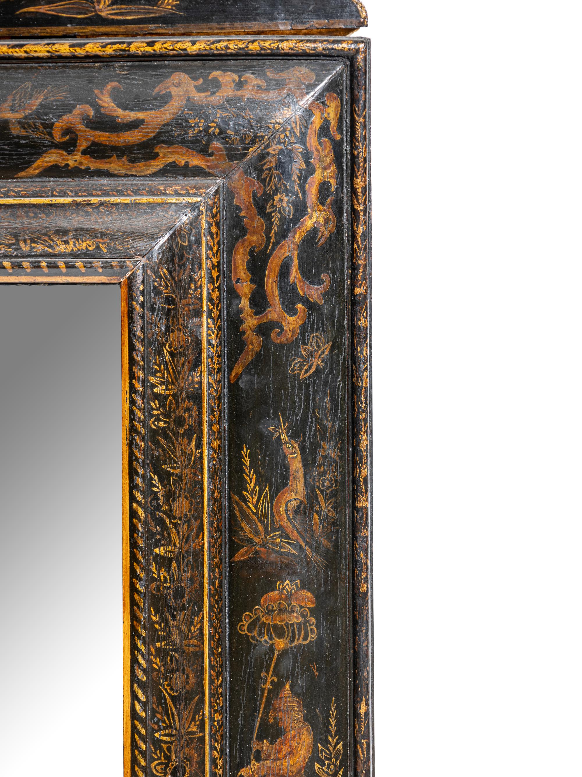 A North Italian Black Japanned Cushion Mirror