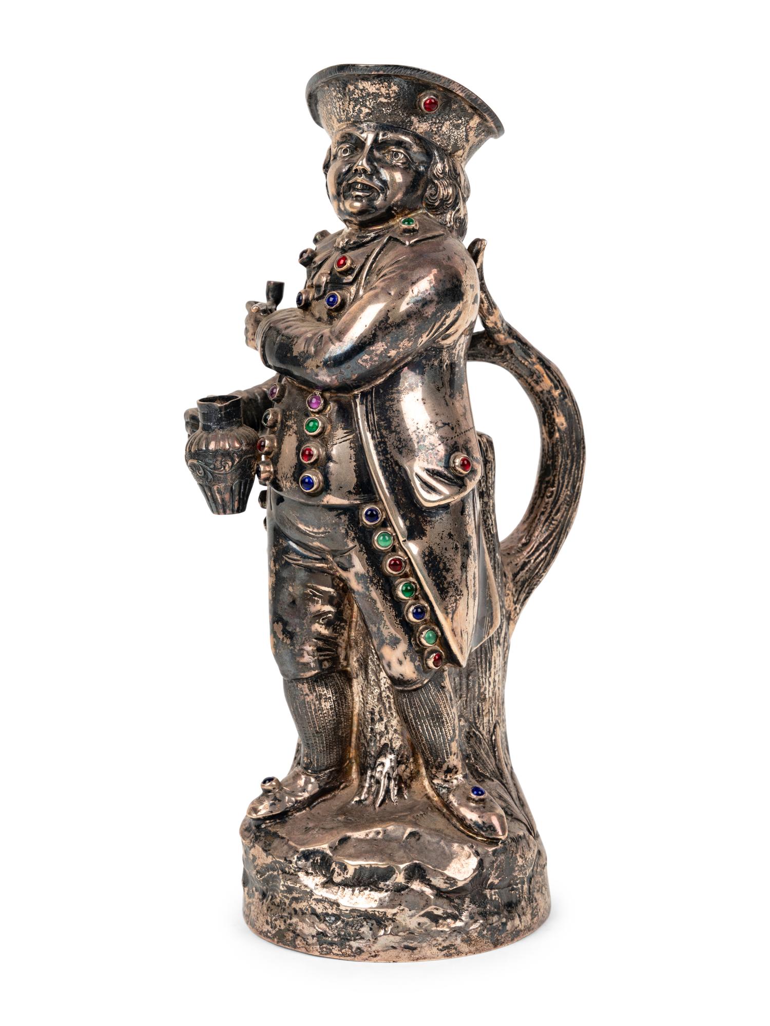 A Hanau Silver and Jewel-Inset "Hearty Good Fellow" Jug