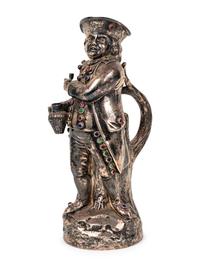 A Hanau Silver and Jewel-Inset "Hearty Good Fellow" Jug