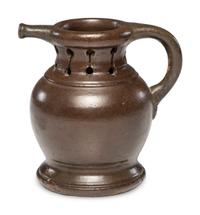 A Rare William Rowley Slip-Glazed Puzzle Jug