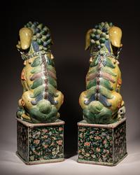 A Large Pair of Chinese Famille Verte Porcelain Figures of Fu Lions