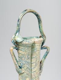 A Roman Green Glass Double Unguentarium