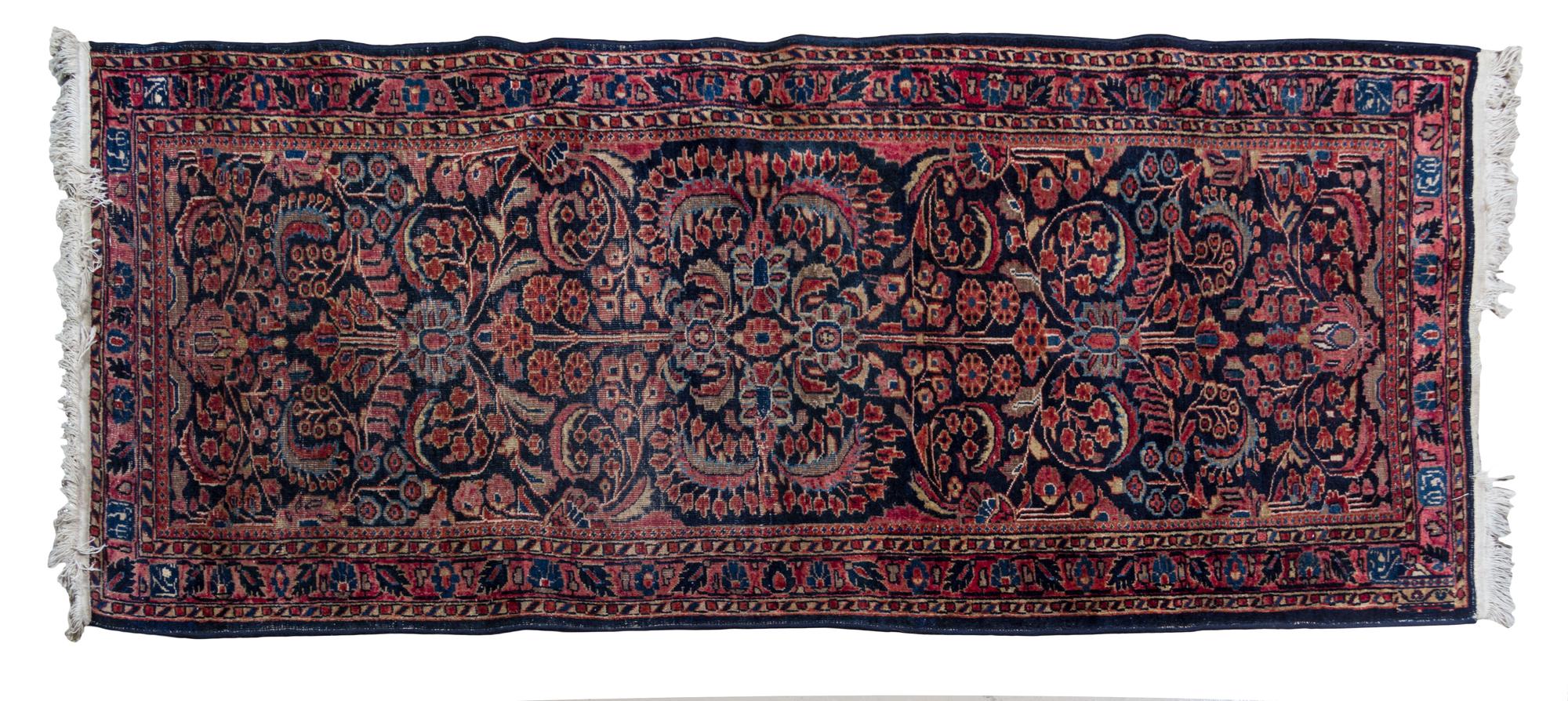 A Sarouk Wool Runner, 2ND QUARTER 20TH CENTURY, 6 feet 7 inches x 2 feet 7 1/2 inches. — 2ND QUARTER 20TH CENTURY