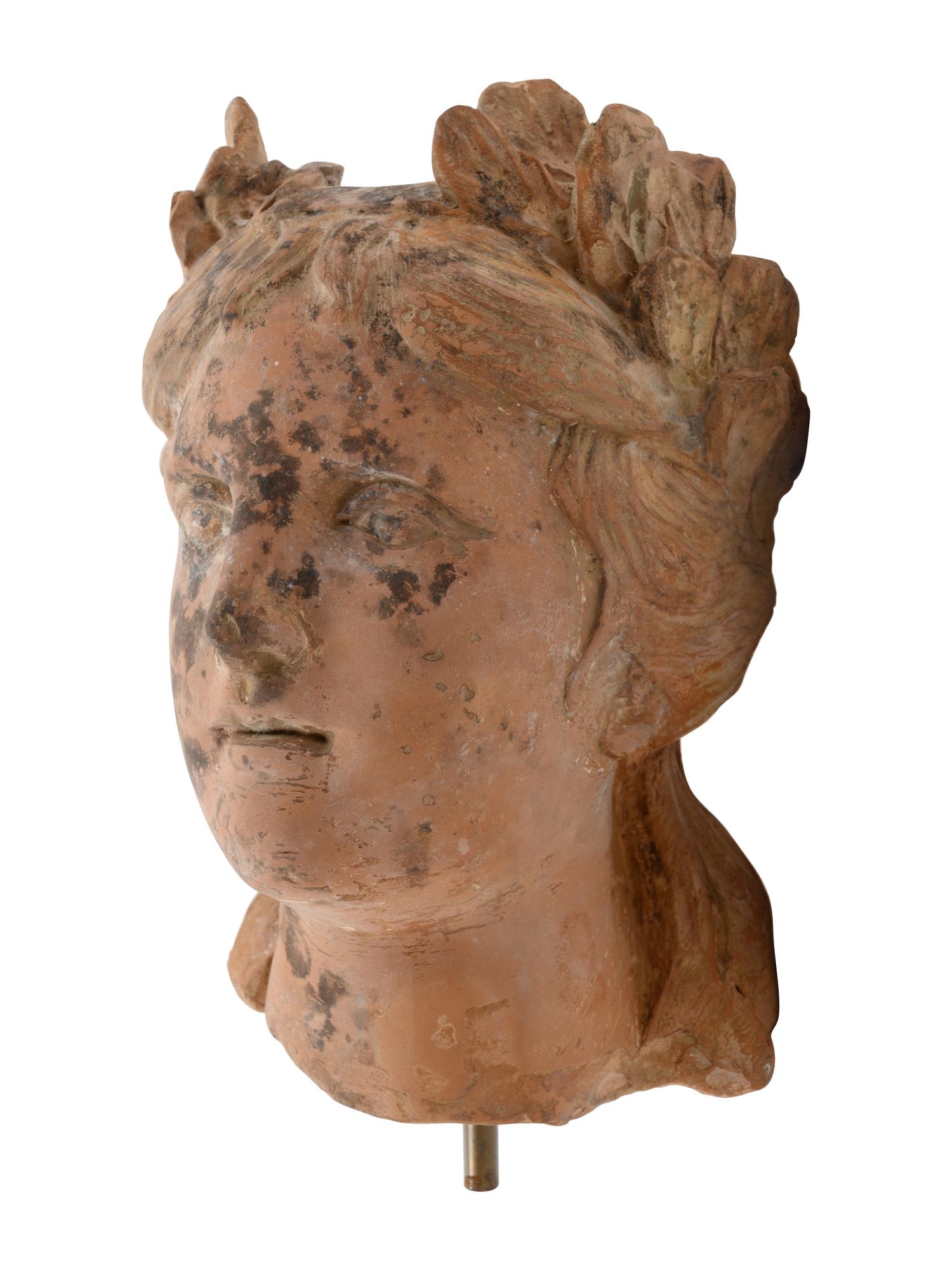 A Roman Style Terracotta Head of a Woman