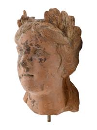 A Roman Style Terracotta Head of a Woman