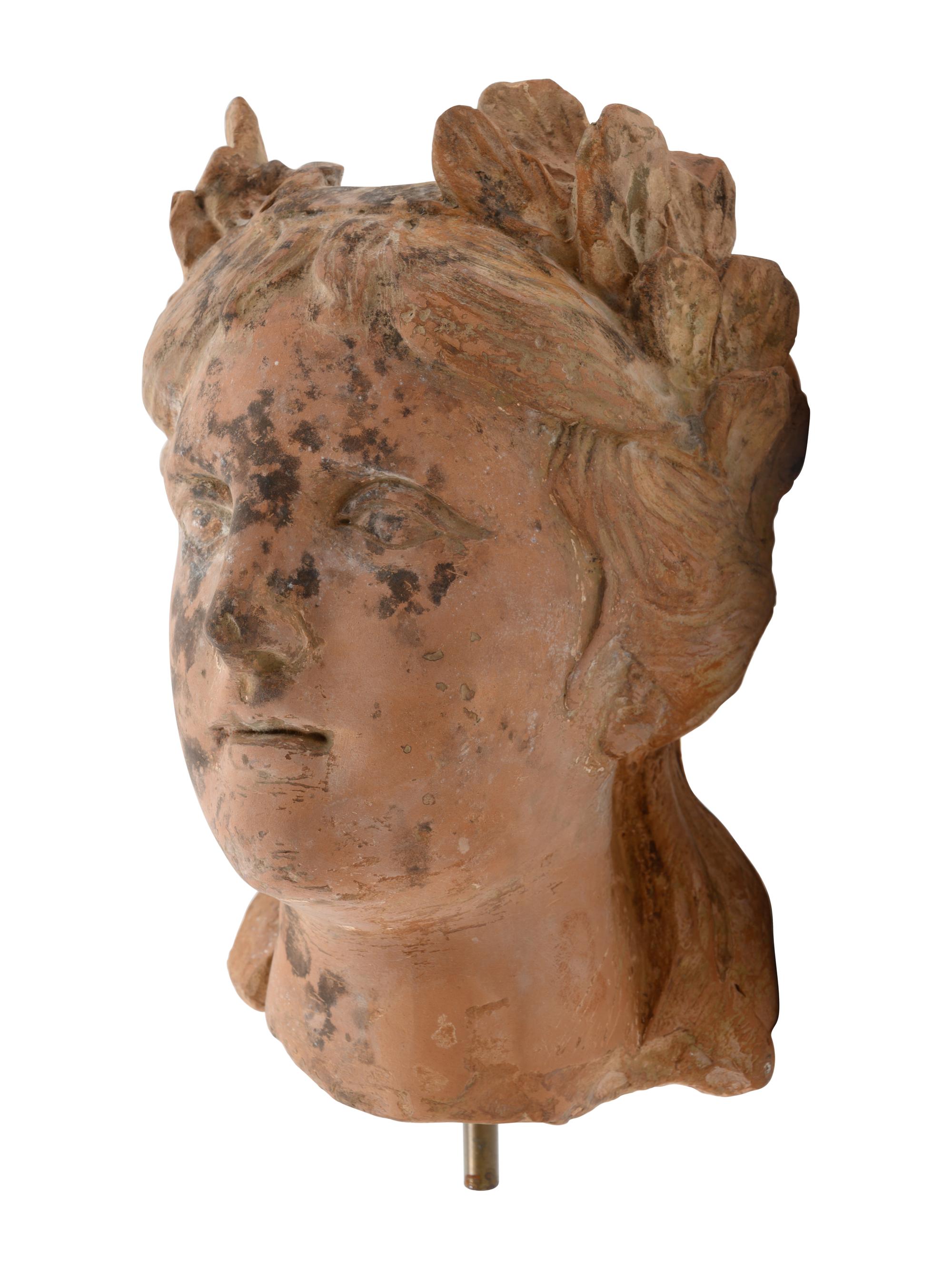 A Roman Style Terracotta Head of a Woman