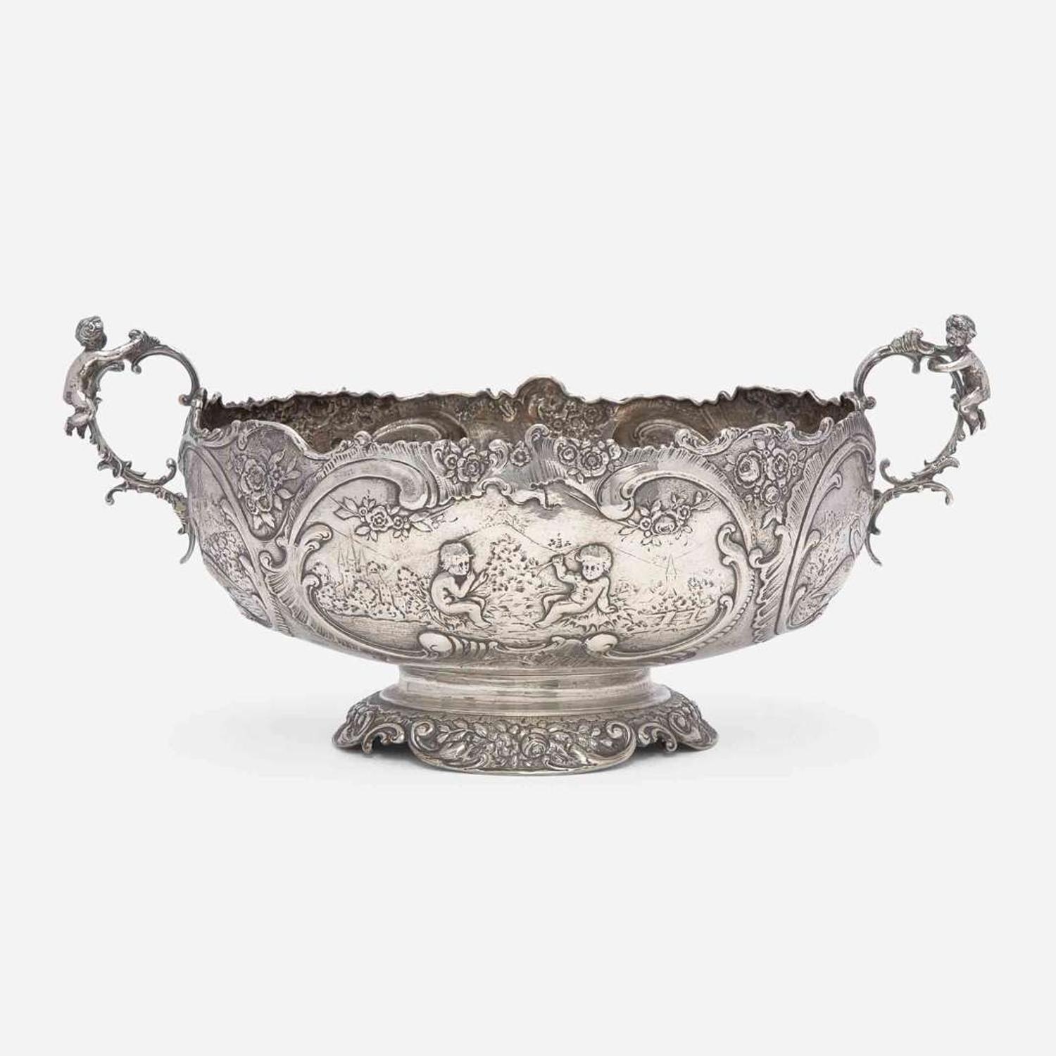 A Continental silver repoussé two-handled centerpeice Likely German, late 19th century