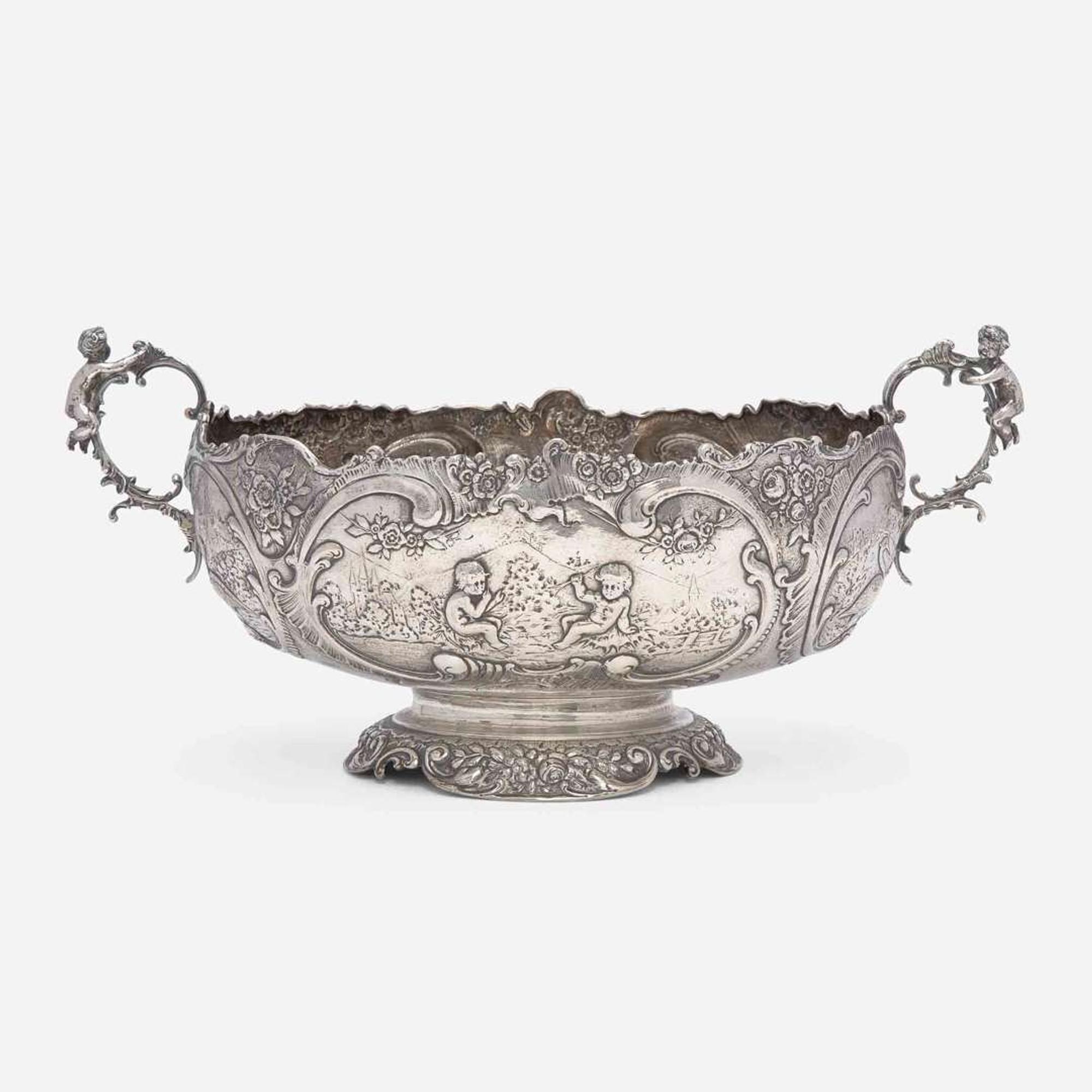 A Continental silver repoussé two-handled centerpeice Likely German, late 19th century