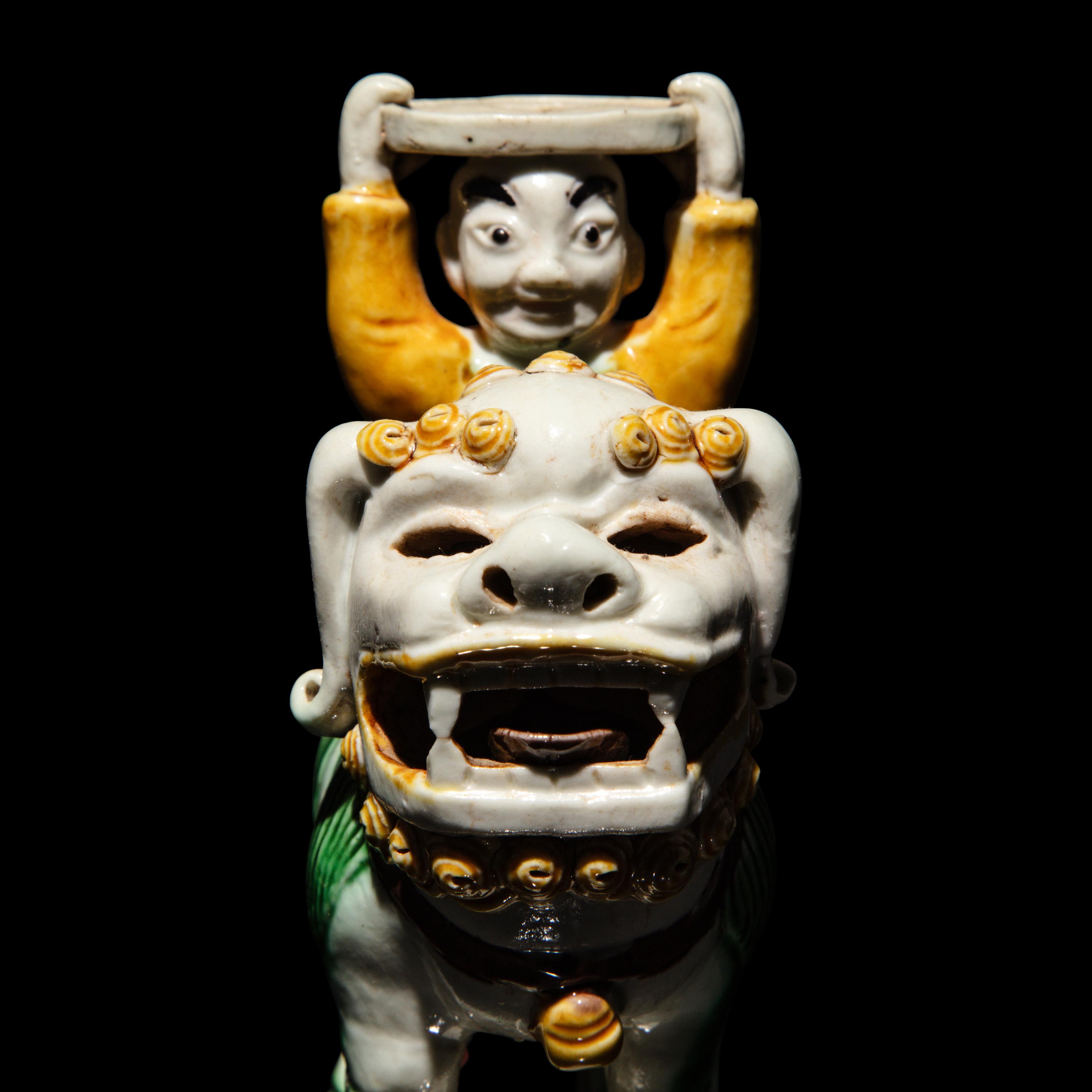 A Pair of Small Chinese Enameled Figures on Lions