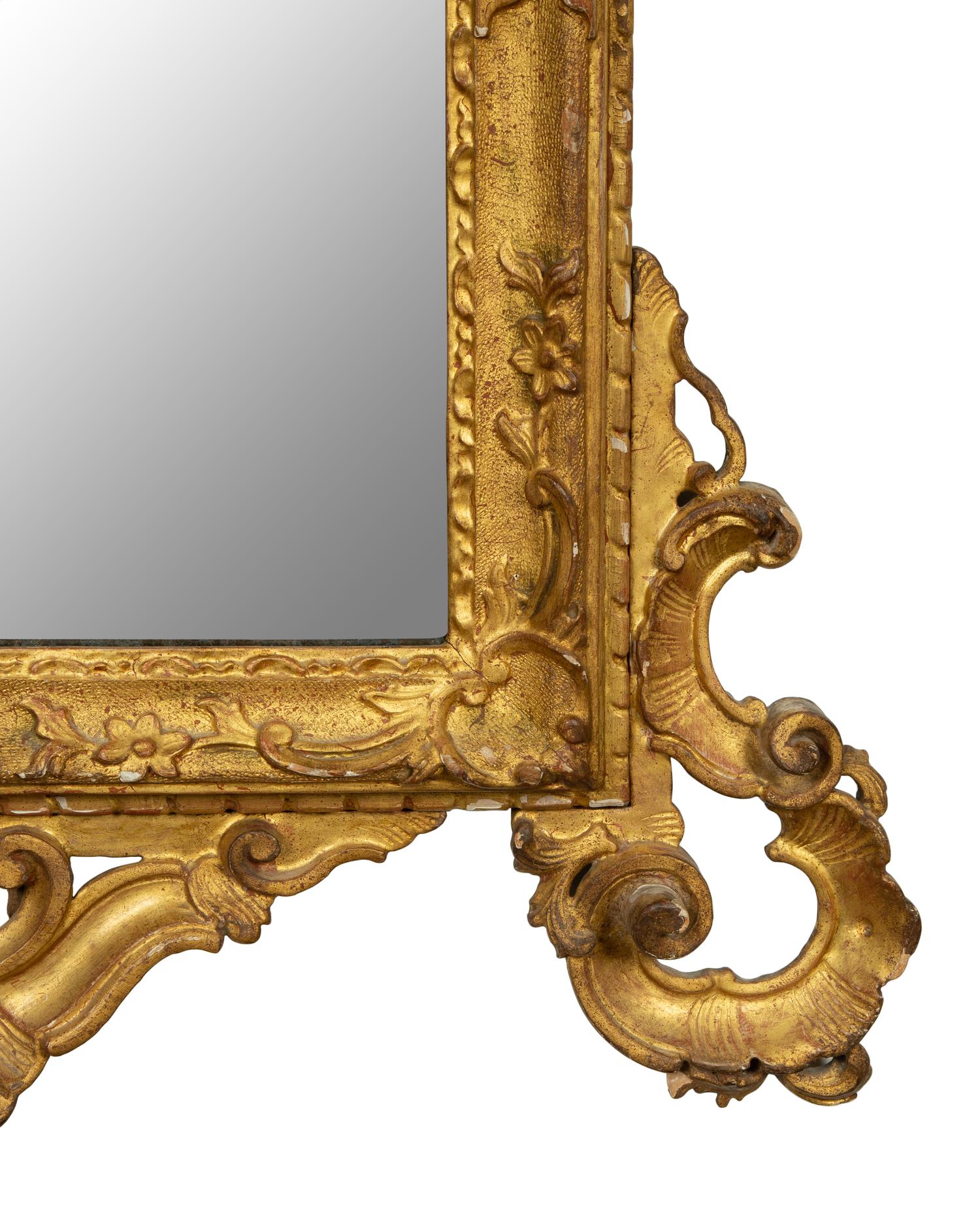 An Italian Rococo Carved Giltwood Mirror — 18TH CENTURY