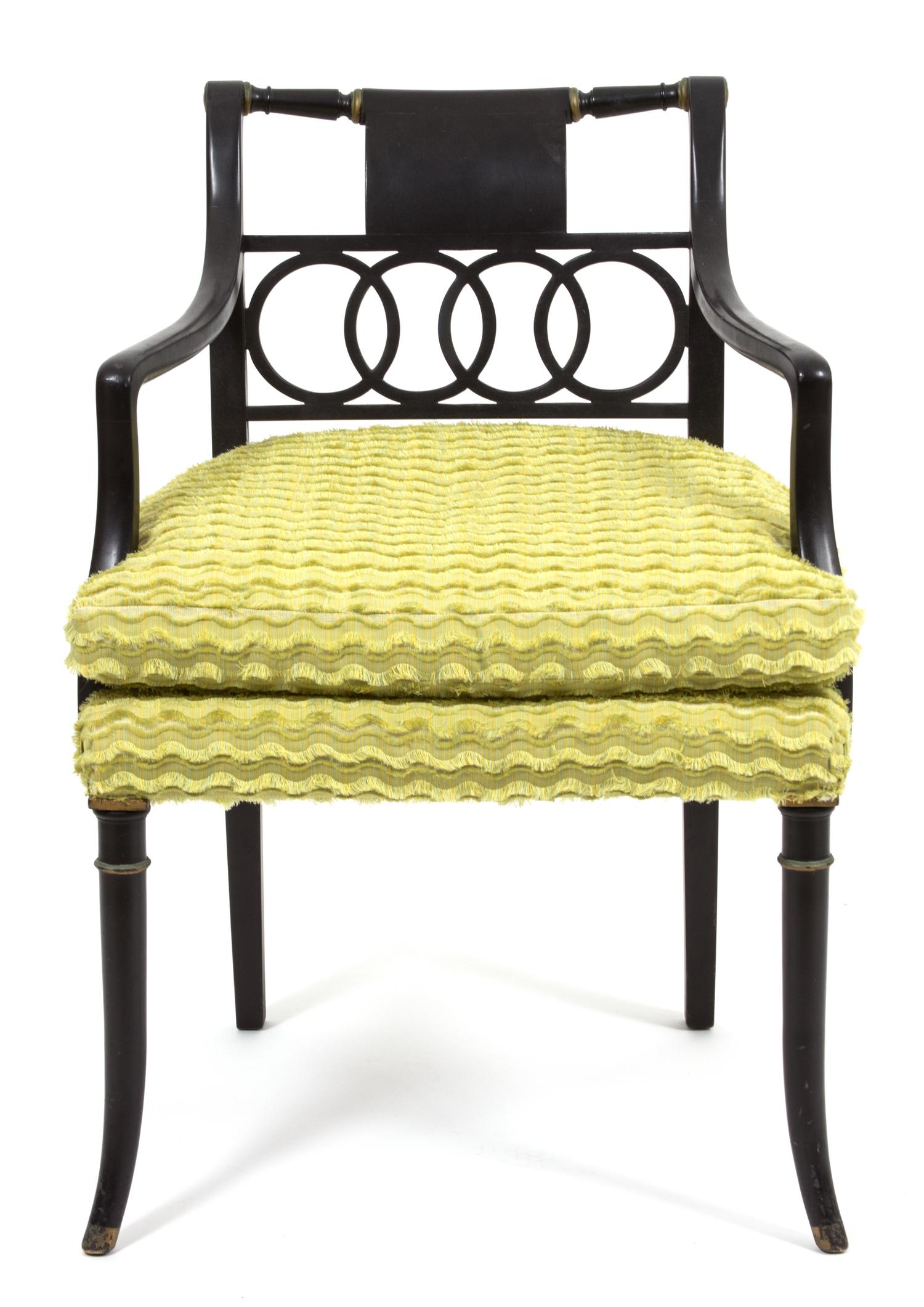 A Regency Style Ebonized Open Armchair Height 32 x width 22 x depth 22 inches.