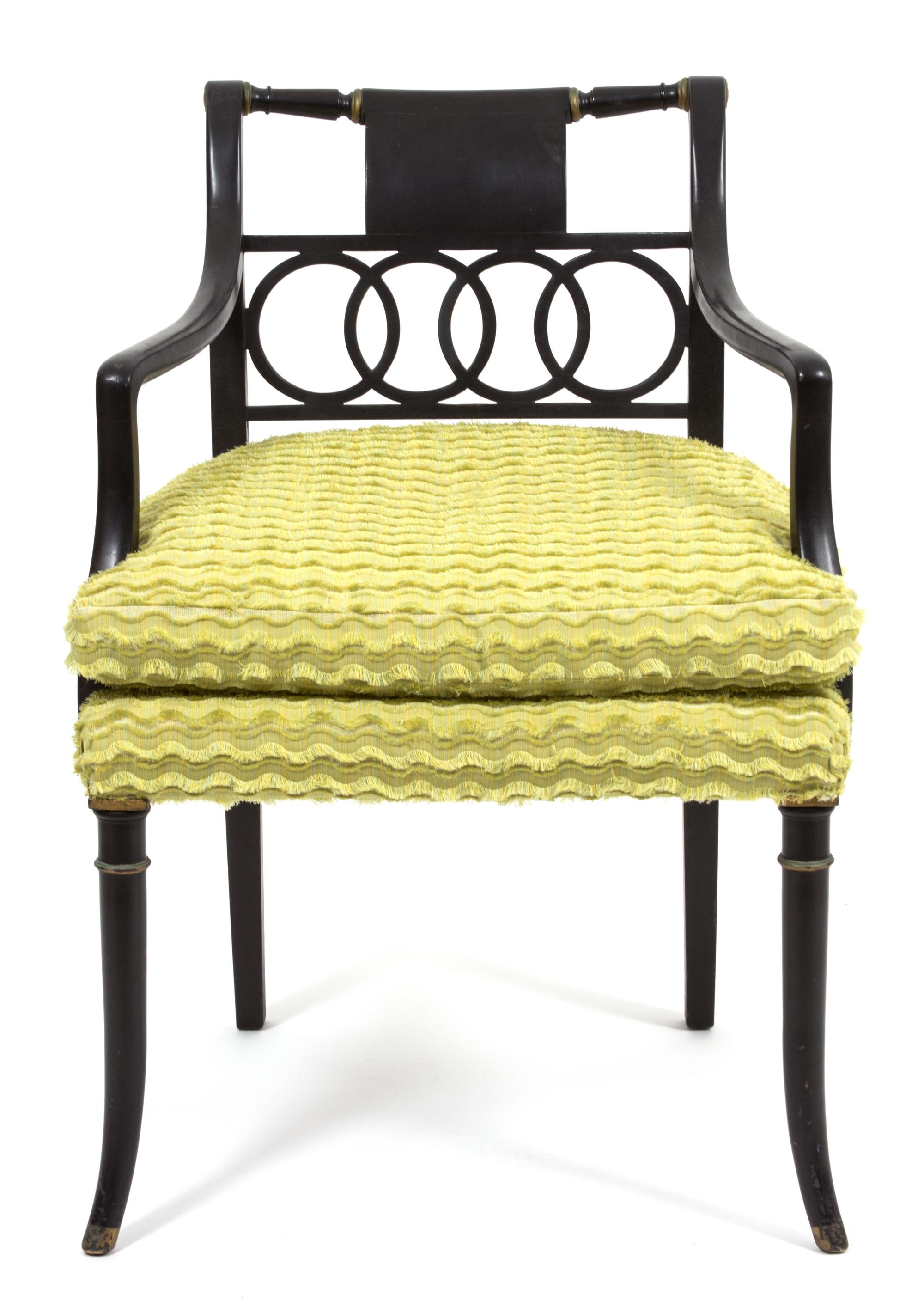 A Regency Style Ebonized Open Armchair Height 32 x width 22 x depth 22 inches.