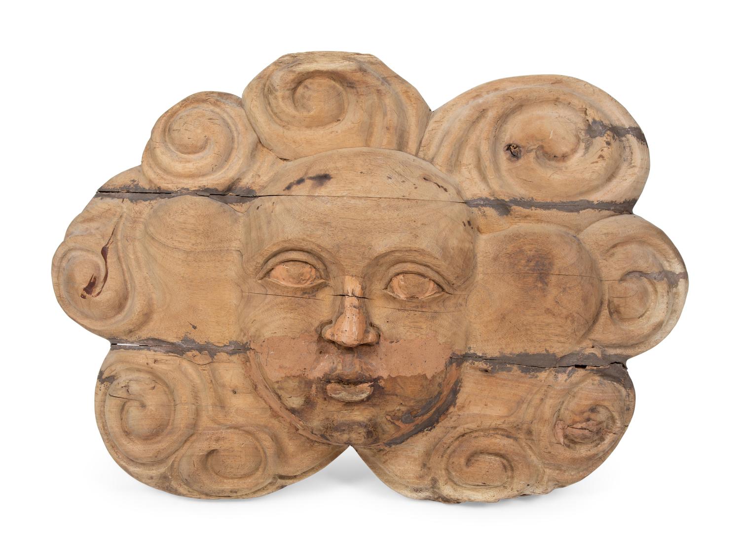 A Continental Carved Wood Face-Form Wall Plaque — 19TH CENTURY