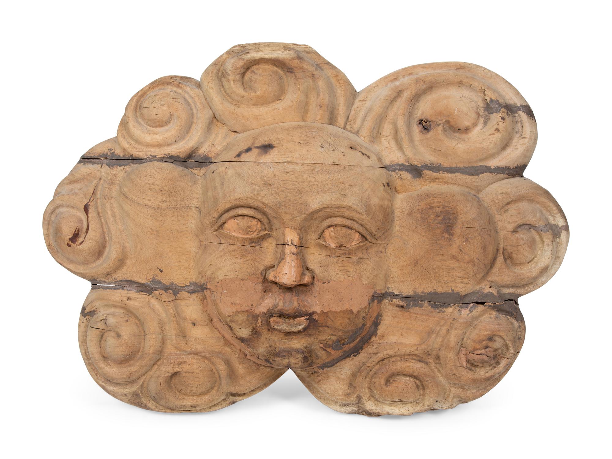 A Continental Carved Wood Face-Form Wall Plaque — 19TH CENTURY