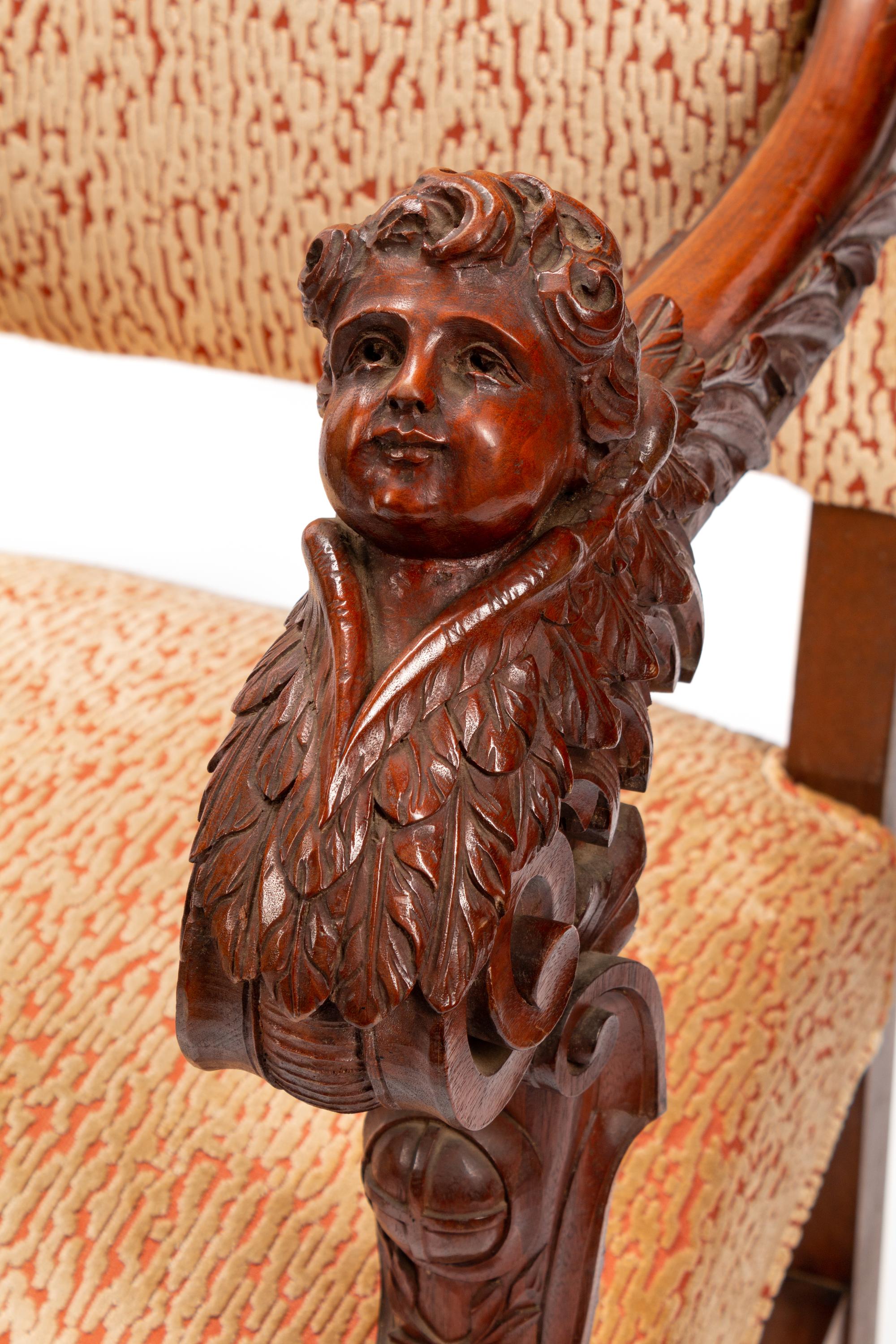 A Pair of Renaissance Style Carved Walnut Armchairs