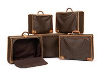Five Louis Vuitton Suitcases, 1970-90s