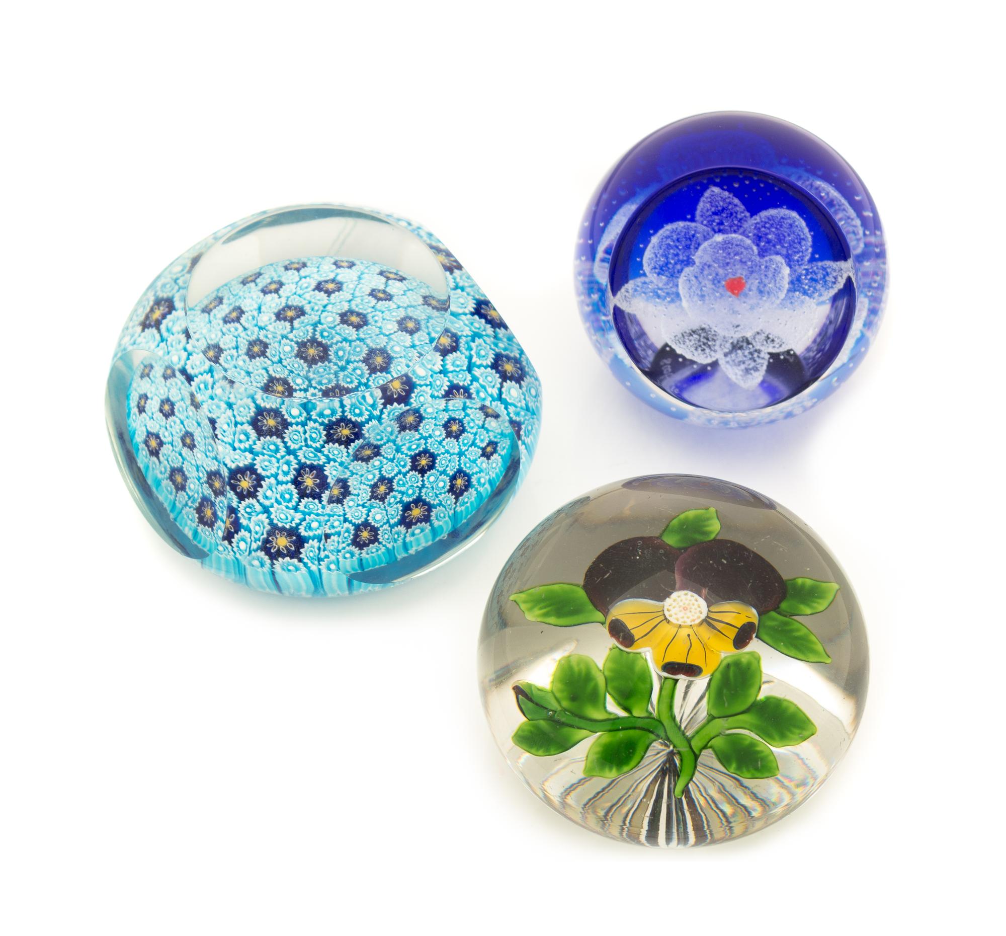 A Group of Three Glass Paperweights, one marked for Caithness