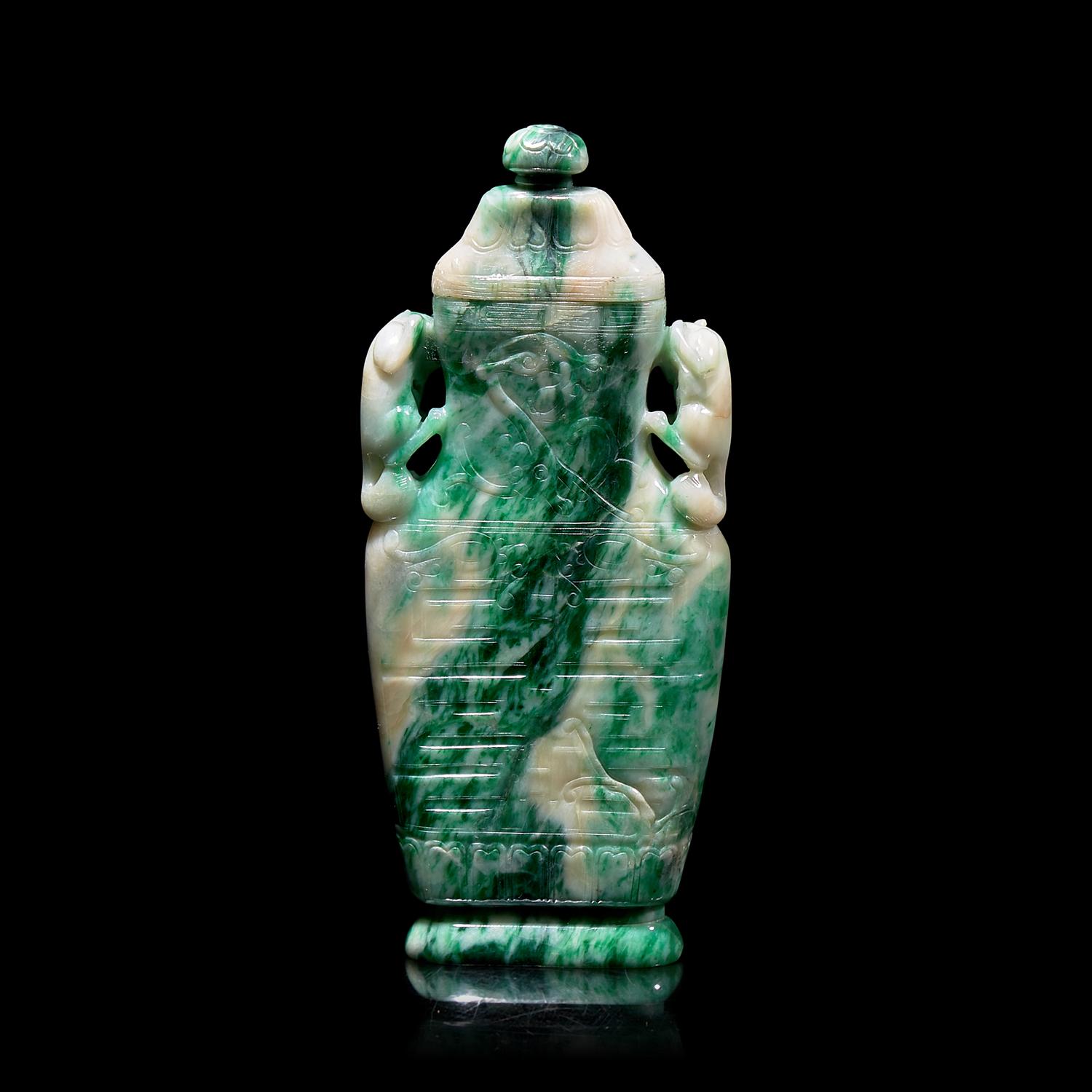 A Chinese Carved Jadeite Vase and Cover 翡翠夔龍紋雙耳蓋瓶