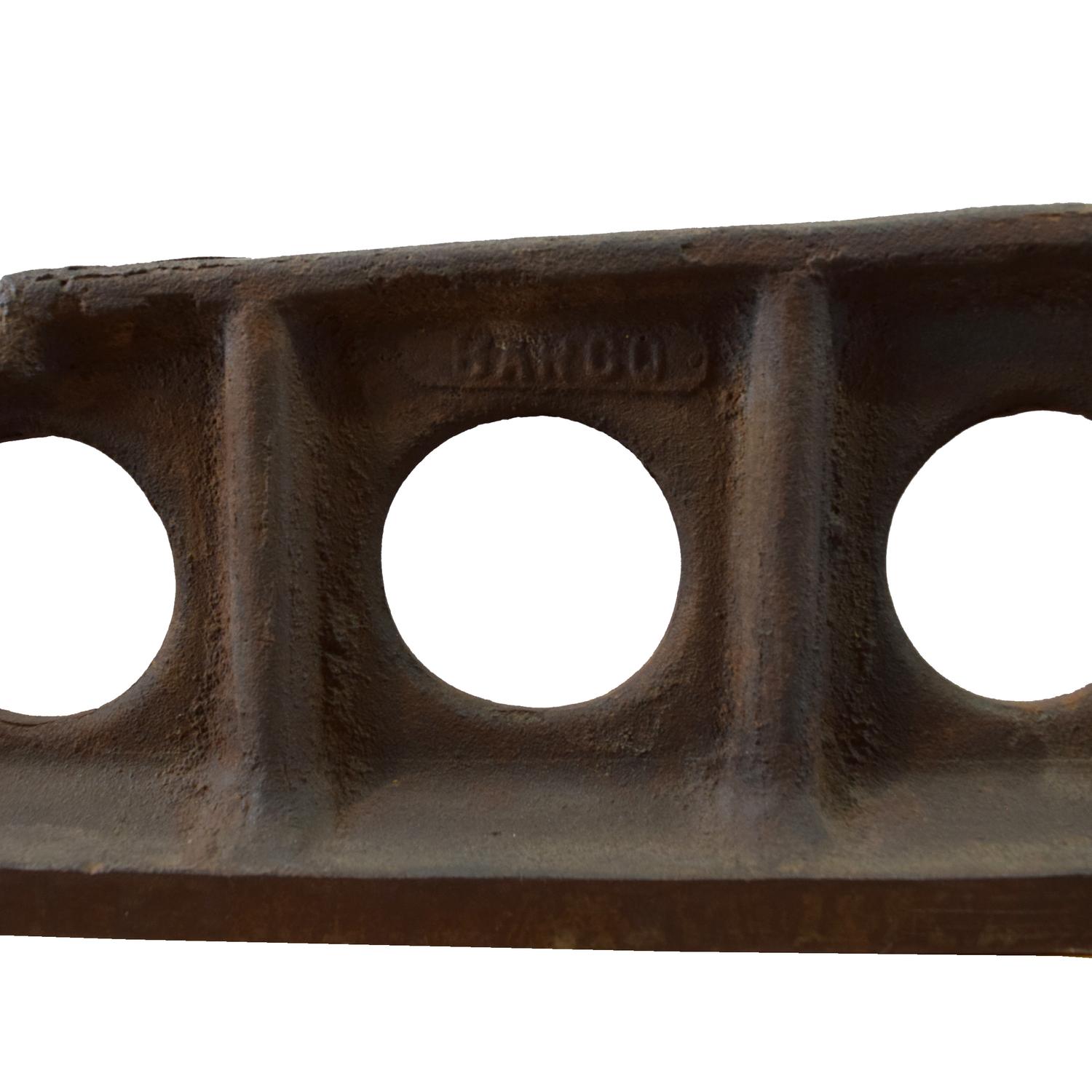 An Industrial Cast Iron Tool 61" W x 3" D x 7" H — United States, Circa 1900