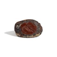 A Roman Iron and Red Jasper Finger Ring with a Gryllos (Composite Figure)
