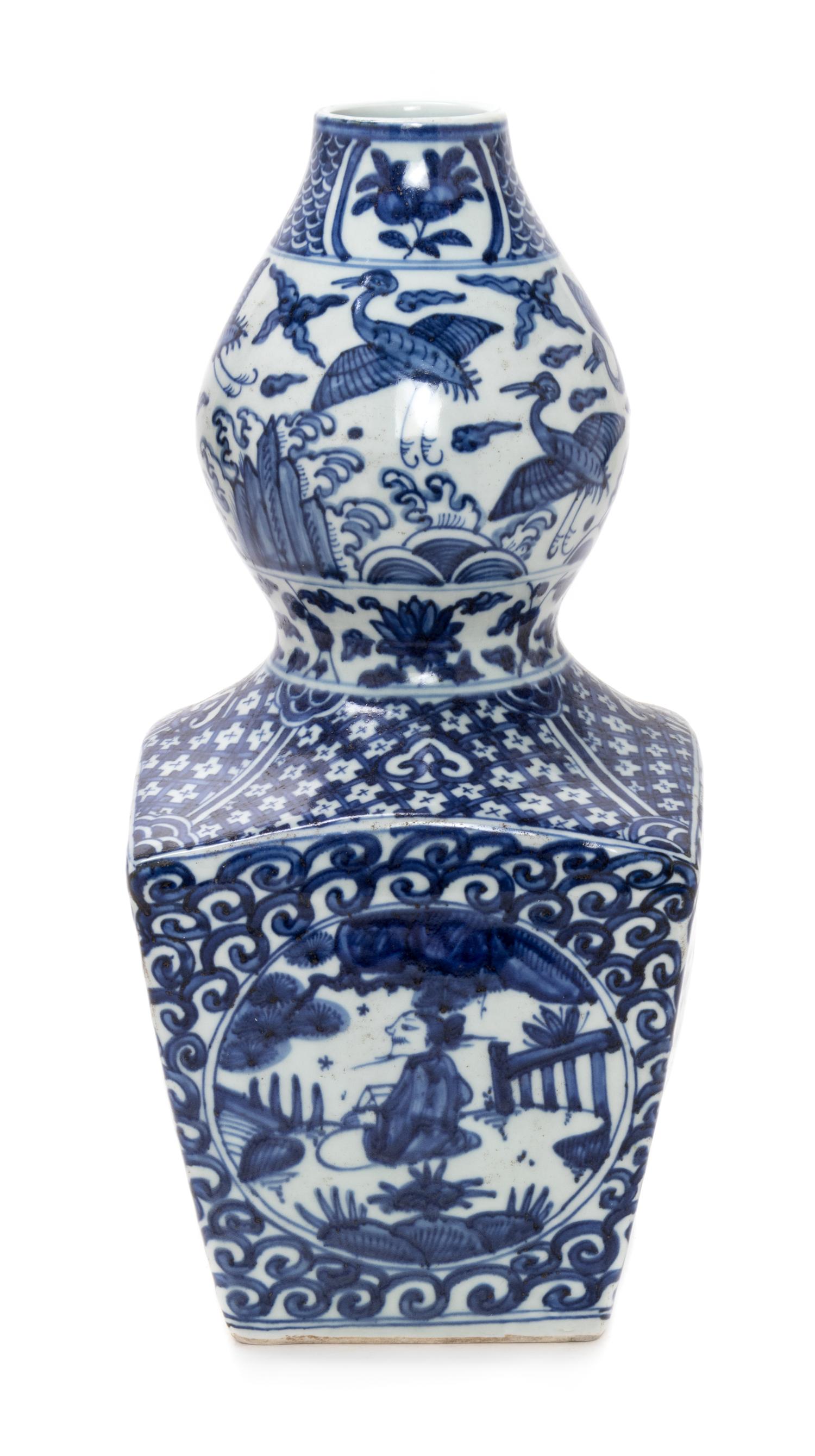 A Chinese Blue and White Gourd-Form Porcelain Vase Height 16 inches. — 20TH CENTURY
